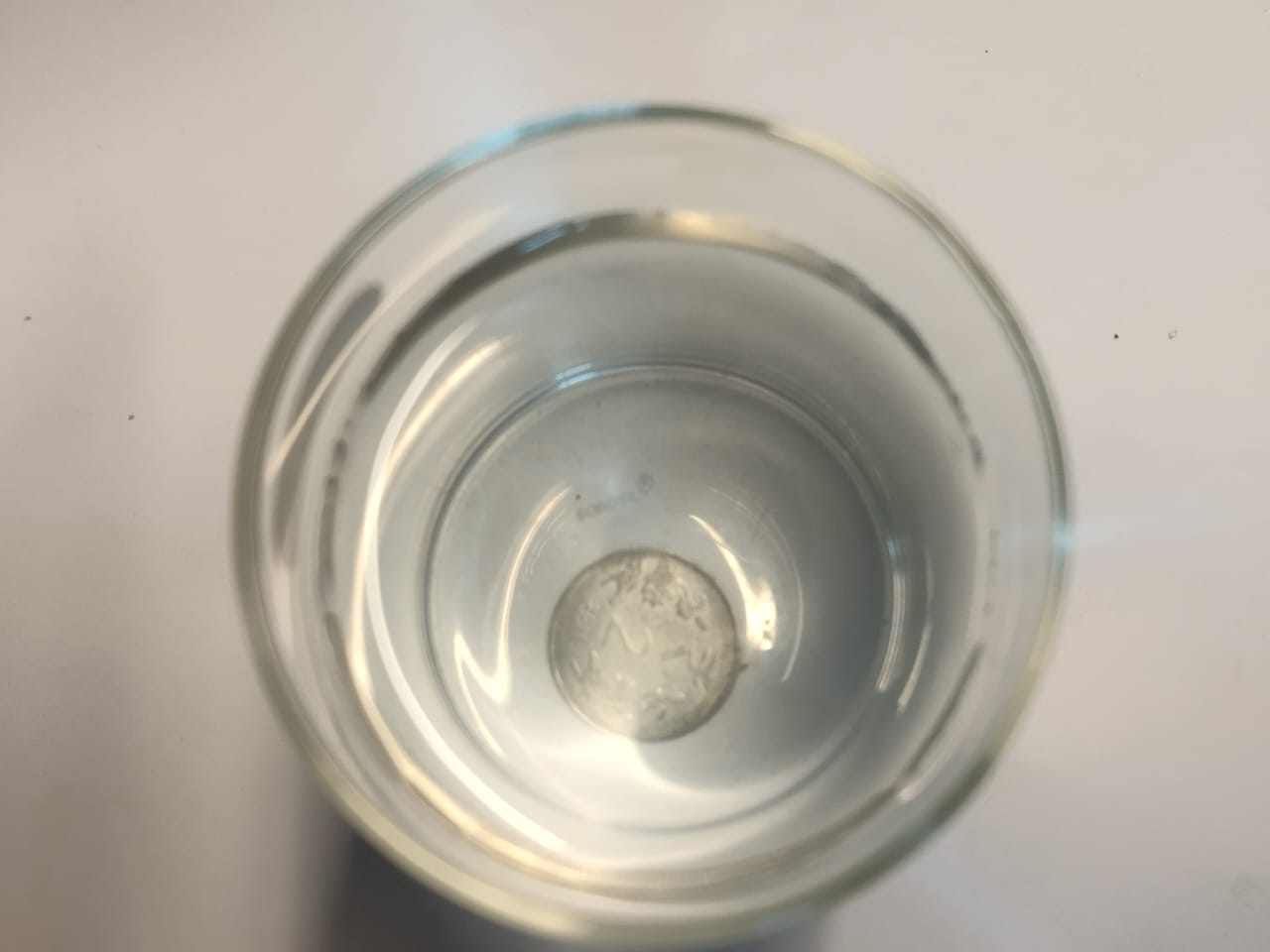 Refraction: Vanishing coin